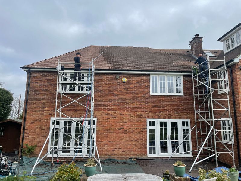 Roof cleaning carried out safely from scaffold towers by The Roof Moss Cleaners in Marston Moretaine